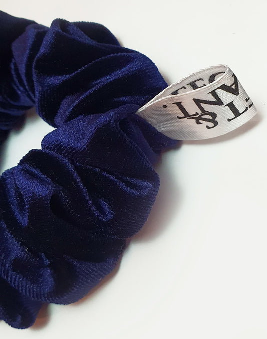 Deep blue velvet scrunchie designed for a stylish and secure hold, ideal for enhancing both casual and formal looks