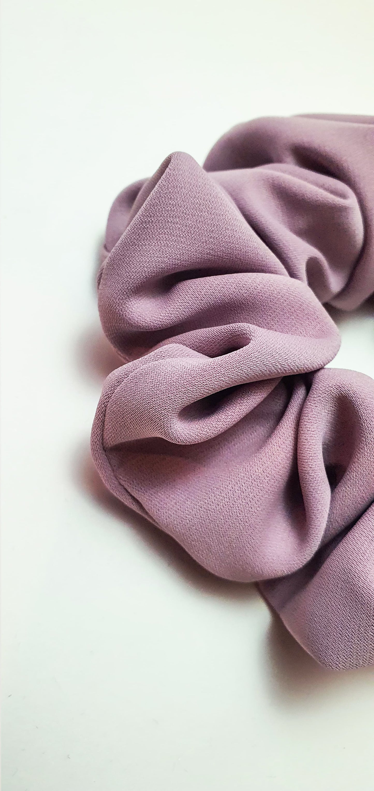 Elegant lavender pink crepe scrunchie designed to prevent hair damage