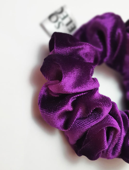 P The Purple Velvet Scrunchie by Softandelegant displayed on a white flat surface with a minimalist background, highlighting its luxurious velvet fabric.